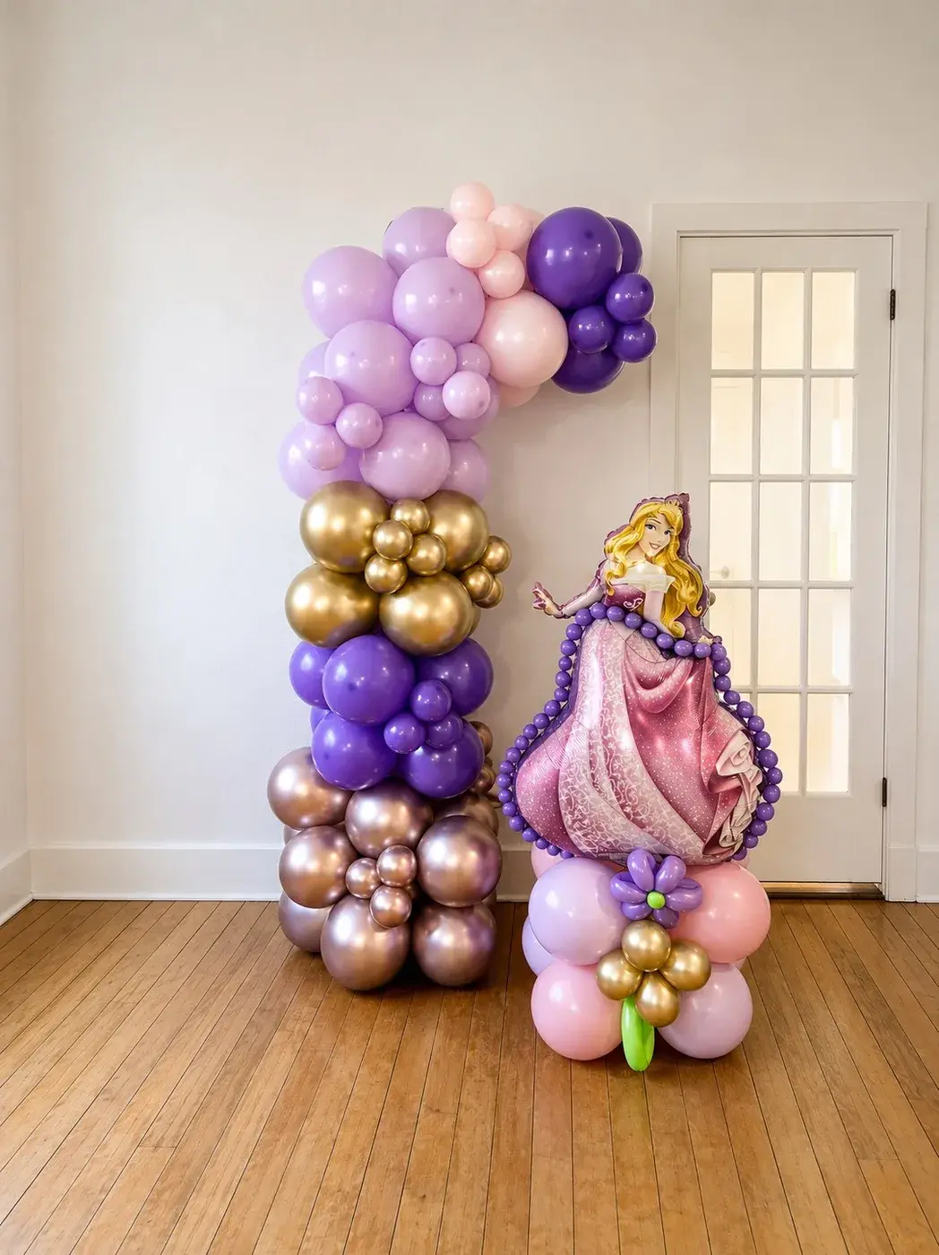Purple, lilac and rose gold column topped with a princess character balloon
