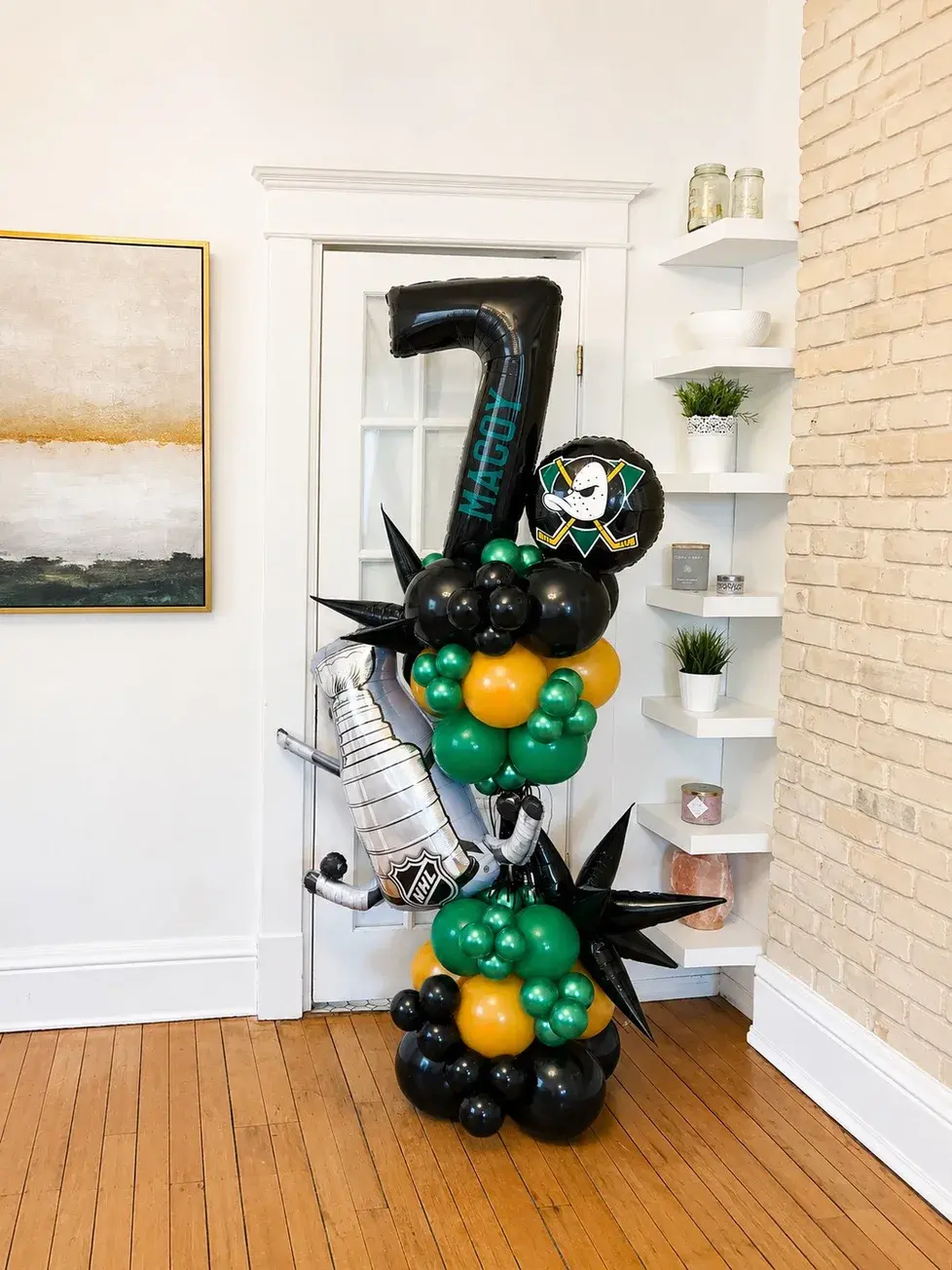 Black and green number seven display with a skull topper